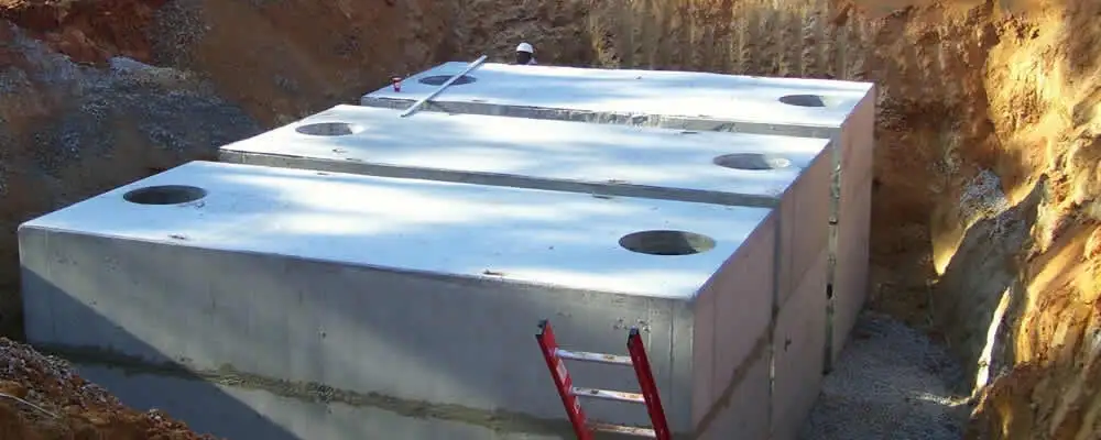 Septic tank installation site with a newly placed concrete tank in Charleston, SC